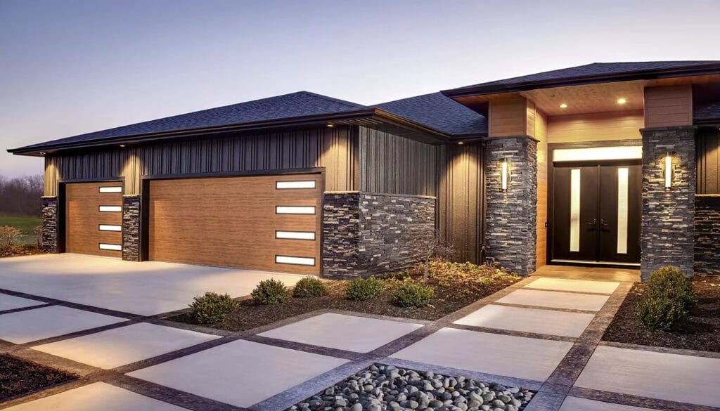 A home exterior featuring stone accents and wood-look garage doors with vertical frosted glass windows that complement the sleek design of modern glass garage doors.